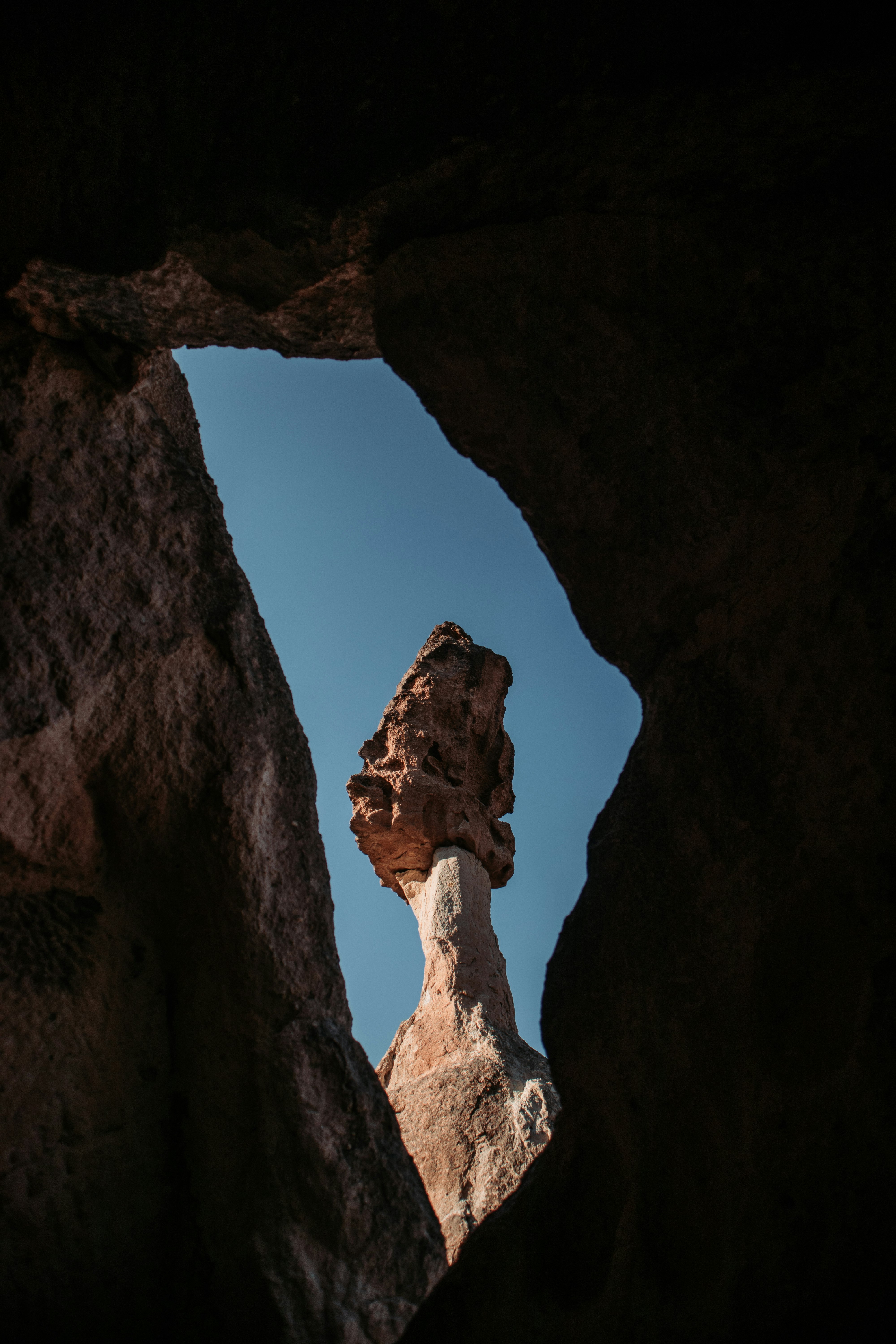 brown rock formation under blue sky during daytime